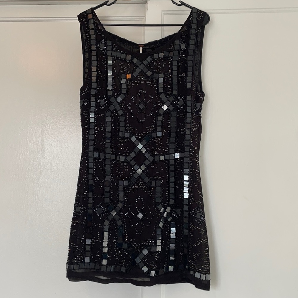 Black sequin and beaded free people dress .